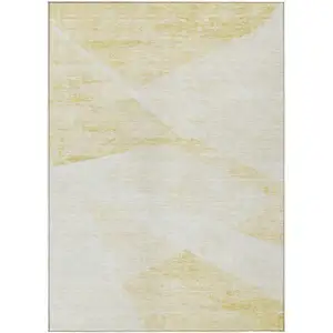 Photo of Gold Beige And Ivory Abstract Washable Indoor Outdoor Area Rug