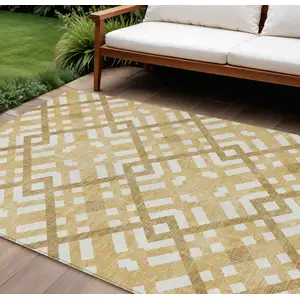 Photo of Gold Beige And Tan Geometric Washable Indoor Outdoor Area Rug