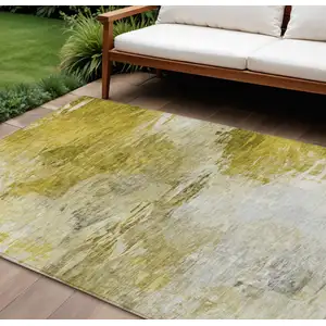 Photo of Gold Beige And Wheat Abstract Washable Indoor Outdoor Area Rug