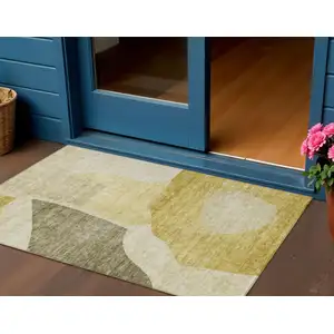 Photo of Gold Beige And Wheat Abstract Washable Indoor Outdoor Area Rug