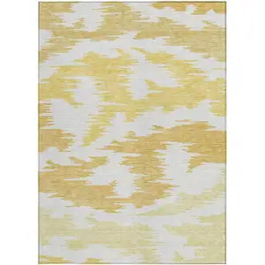 Photo of Gold Beige And Wheat Abstract Washable Indoor Outdoor Area Rug