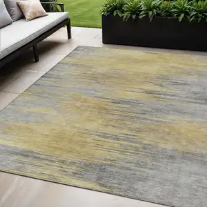 Photo of Gold Gray And Charcoal Abstract Washable Indoor Outdoor Area Rug