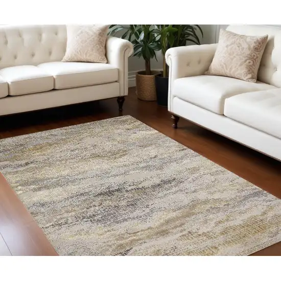 Gold Gray And Ivory Abstract Stain Resistant Area Rug Photo 1