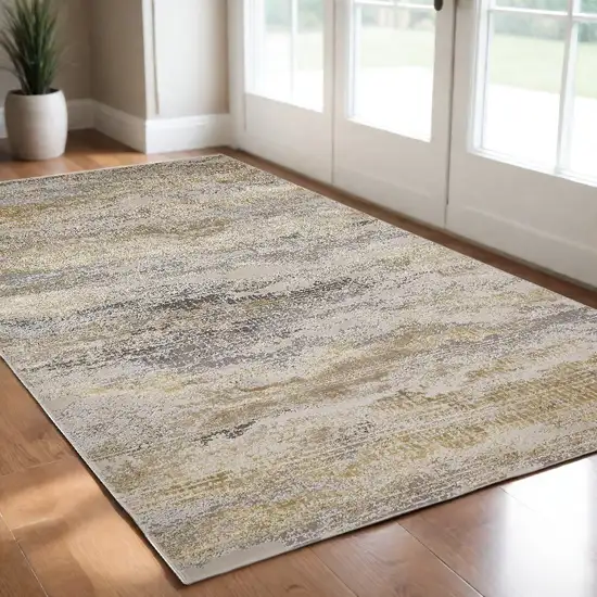 Gold Gray And Ivory Abstract Stain Resistant Area Rug Photo 1