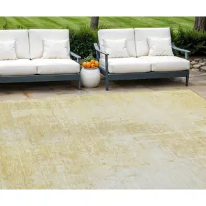 Photo of Gold Ivory And Beige Abstract Washable Indoor Outdoor Area Rug