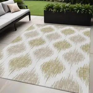 Photo of Gold Ivory And Beige Ikat Washable Indoor Outdoor Area Rug