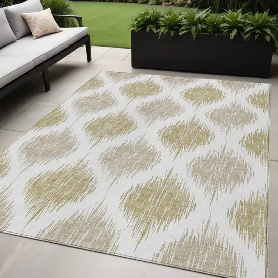 Gold Ivory And Beige Ikat Washable Indoor Outdoor Area Rug Photo 1