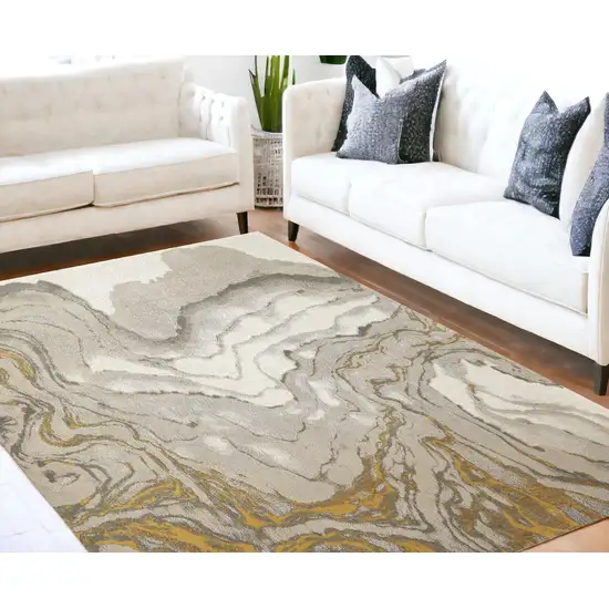 Gold Ivory And Gray Abstract Stain Resistant Area Rug Photo 1