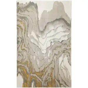 Photo of Gold Ivory And Gray Abstract Stain Resistant Area Rug