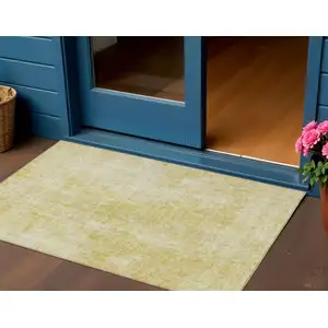 Photo of Gold Wheat And Ivory Abstract Washable Indoor Outdoor Area Rug