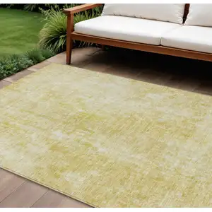 Photo of Gold Wheat And Ivory Abstract Washable Indoor Outdoor Area Rug