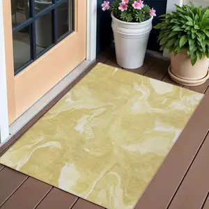 Photo of Gold Wheat And Ivory Abstract Washable Indoor Outdoor Area Rug