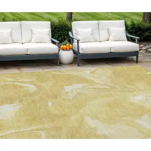 Photo of Gold Wheat And Ivory Abstract Washable Indoor Outdoor Area Rug