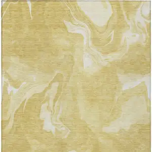 Photo of Gold Wheat And Ivory Abstract Washable Indoor Outdoor Area Rug