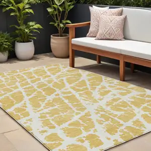 Photo of Gold and White Abstract Washable Non Skid Indoor Outdoor Area Rug