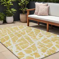 Photo of Gold and White Abstract Washable Non Skid Indoor Outdoor Area Rug