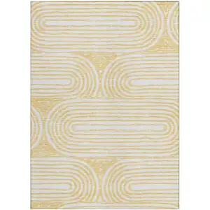 Photo of Gold and White Abstract Washable Non Skid Indoor Outdoor Area Rug