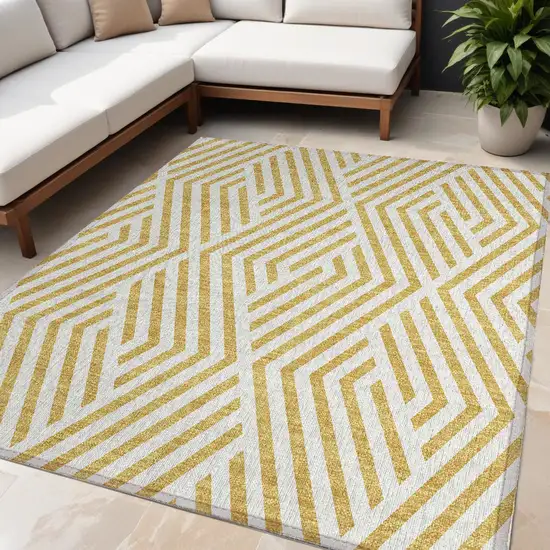 Gold and White Geometric Washable Non Skid Indoor Outdoor Area Rug Photo 1