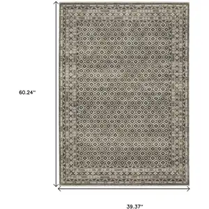 Photo of Gray And Beige Diamond Area Rug With Fringe