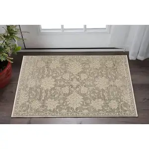 Photo of Gray And Beige Floral Area Rug With Fringe