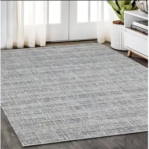 Photo of Gray And Blue Striped Hand Tufted Area Rug