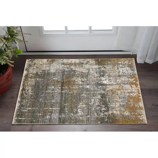 Gray And Gold Abstract Area Rug With Fringe Photo 1