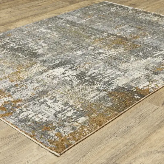 Gray And Gold Abstract Area Rug With Fringe Photo 7