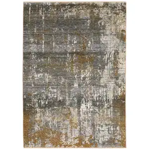 Photo of Gray And Gold Abstract Area Rug With Fringe