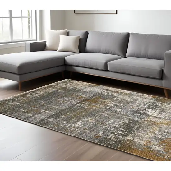 Gray And Gold Abstract Area Rug With Fringe Photo 1