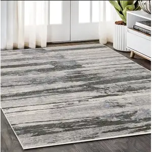 Photo of Gray And Ivory Abstract Area Rug With Fringe