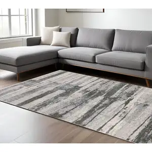 Photo of Gray And Ivory Abstract Area Rug With Fringe