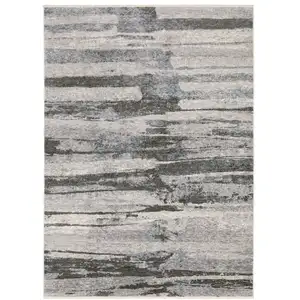 Photo of Gray And Ivory Abstract Area Rug With Fringe