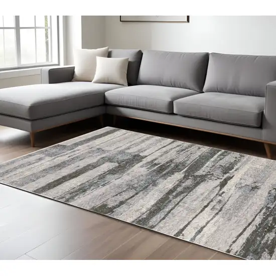 Gray And Ivory Abstract Area Rug With Fringe Photo 1