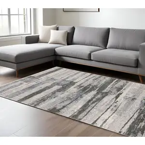 Photo of Gray And Ivory Abstract Area Rug With Fringe