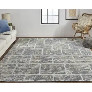 Photo of Gray And Ivory Abstract Hand Woven Area Rug