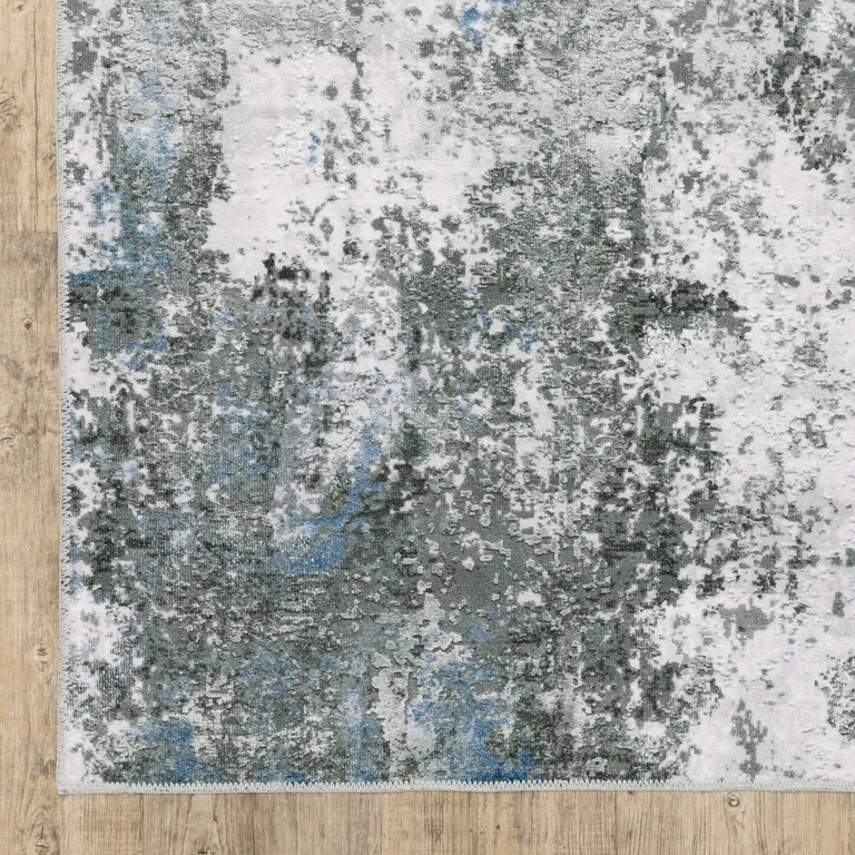 Gray And Ivory Abstract Printed Stain Resistant Non Skid Area Rug Photo 1