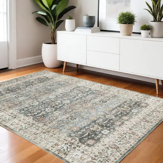 Gray And Ivory Oriental Distressed Area Rug Photo 1