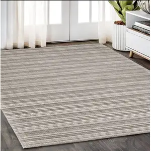 Photo of Gray And Ivory Striped Hand Tufted Area Rug