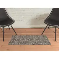Photo of Gray Black And Ivory Striped Stain Resistant Area Rug