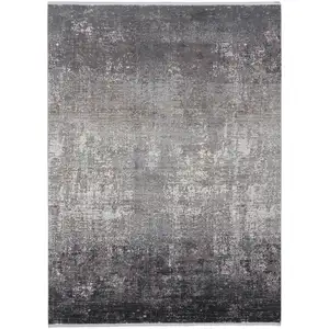 Photo of Gray Black And Silver Abstract Power Loom Distressed Area Rug With Fringe