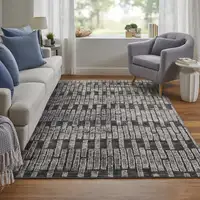 Photo of Gray Black and Ivory Geometric Power Loom Worn Faded Area Rug