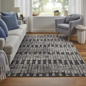 Photo of Gray Black and Ivory Geometric Power Loom Worn Faded Area Rug