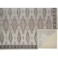 Photo of Gray Blue And Orange Floral Stain Resistant Area Rug