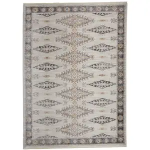 Photo of Gray Blue And Orange Floral Stain Resistant Area Rug