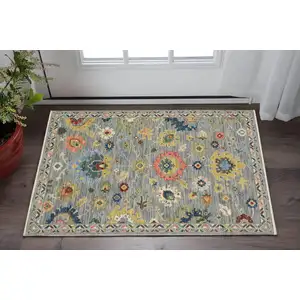 Photo of Gray Blue And Yellow Oriental Area Rug With Fringe