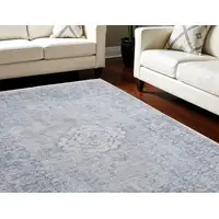 Photo of Gray Blue and Ivory Oriental Hand Woven Distressed Area Rug With Fringe