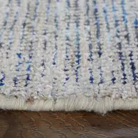 Photo of Gray Blue and Ivory Oriental Hand Woven Distressed Area Rug With Fringe