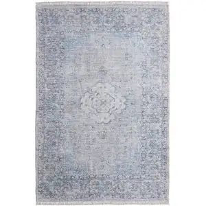 Photo of Gray Blue and Ivory Oriental Hand Woven Distressed Area Rug With Fringe