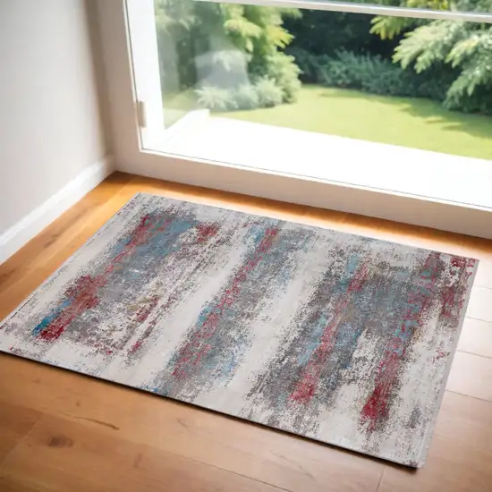 Gray Blue and Red Abstract Power Loom Area Rug With Fringe Photo 1