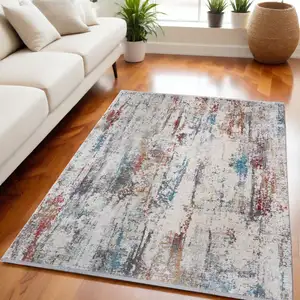 Photo of Gray Blue and Red Abstract Power Loom Area Rug With Fringe